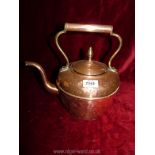 A copper kettle with lid and handle.