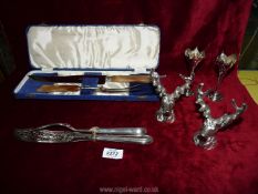 A Sheffield carving set in presentation box, an Edwardian EP pair of fish servers,