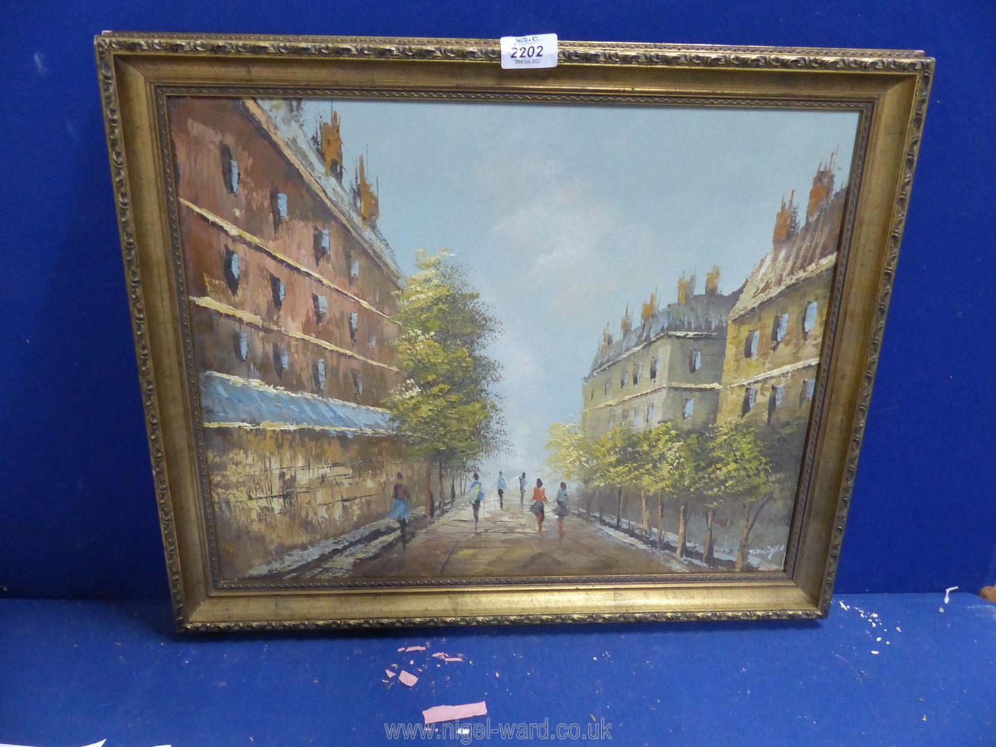 A gilt framed Oil on canvas depicting Continental street scene, signed lower right D. Knight.