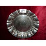 A metal hammered dish stamped 'Made in England', 10" diameter.