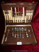 A wooden box of cutlery by J. Stead & Co. Ltd.