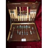 A wooden box of cutlery by J. Stead & Co. Ltd.