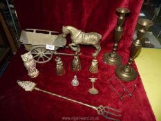 A quantity of brass including candlesticks, horse and cart, bells etc.