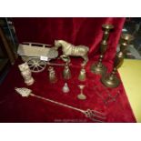 A quantity of brass including candlesticks, horse and cart, bells etc.