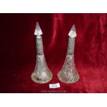 A pair of cut glass large perfume bottles with decorative silver necks, Birmingham 1902, maker J.H.