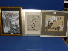 Three Oriental pictures to include a floral painting on silk, writing on hand made paper,