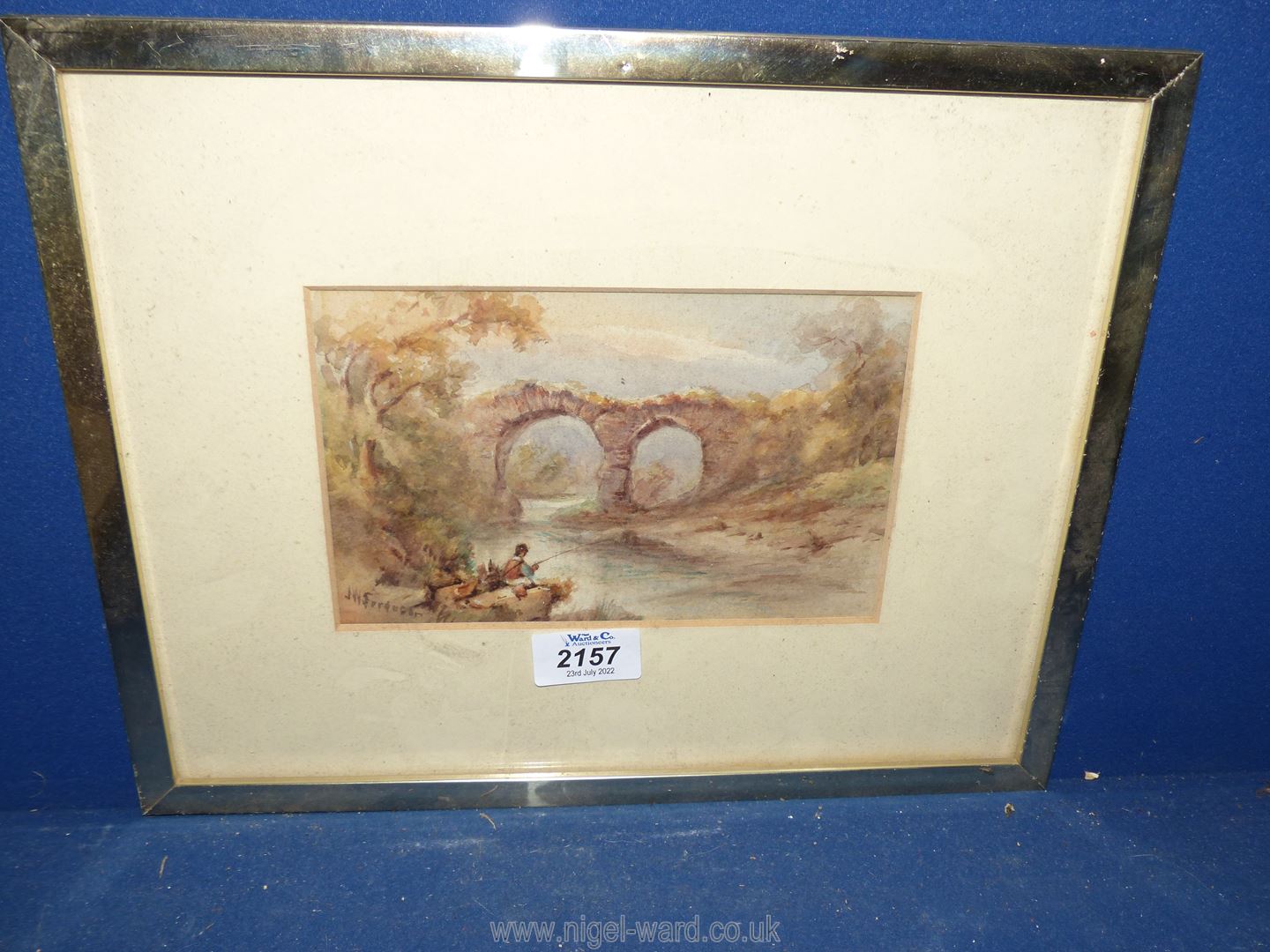 A small framed and mounted Watercolour depicting a Gentleman sat by river fishing near an old stone