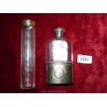 A glass flask with silver base and lid with G.