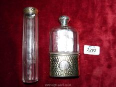 A glass flask with silver base and lid with G.