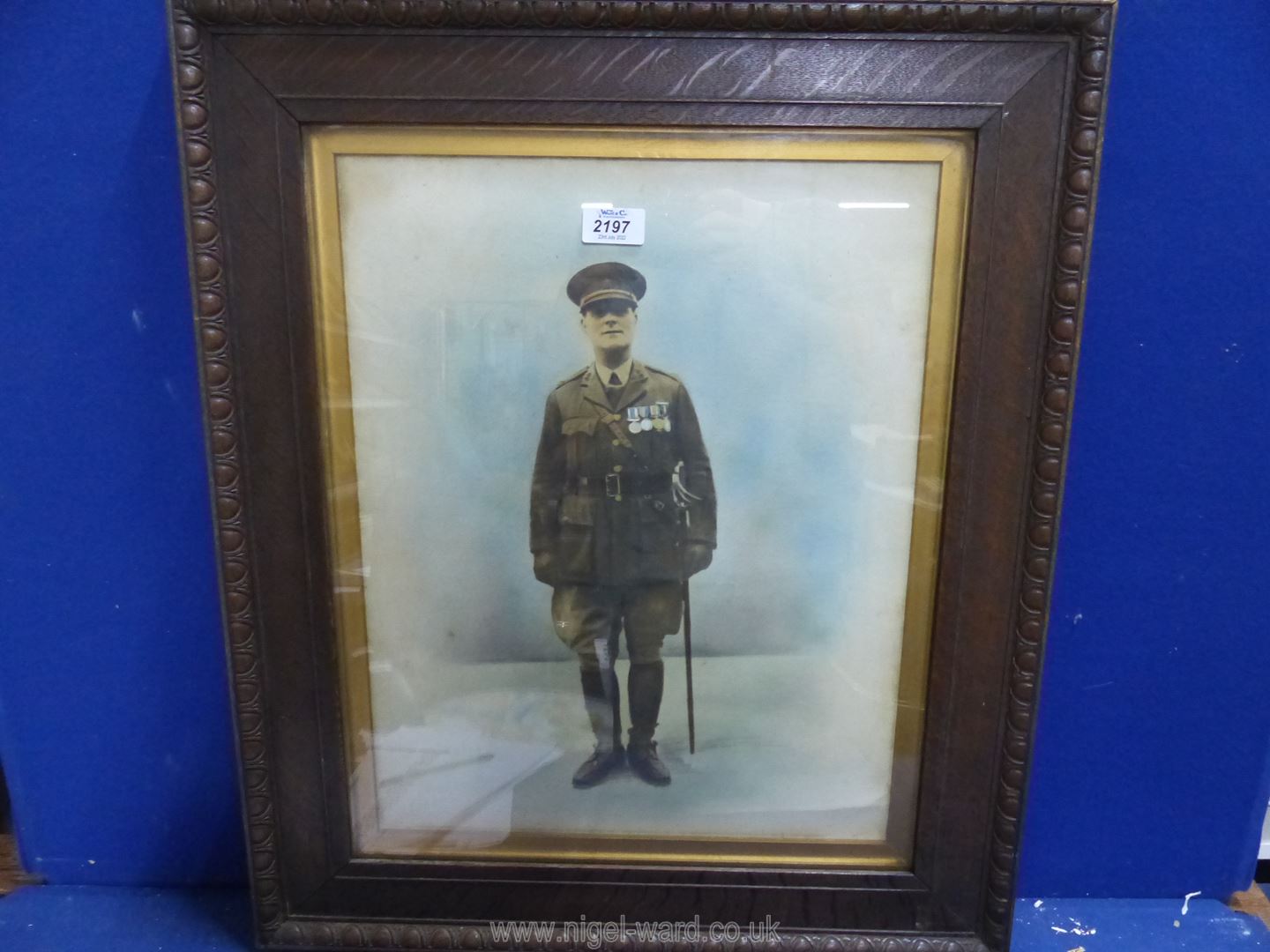A carved wooden framed coloured Lithograph of a military officer. - Image 2 of 3