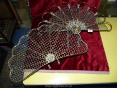 Two brass and mesh fan shaped fire fronts, one with berry and leaf detail,