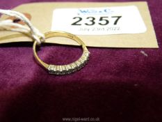 A 9ct gold and diamond ring in Pave setting; 9 small diamonds in total, ring size 'O'.