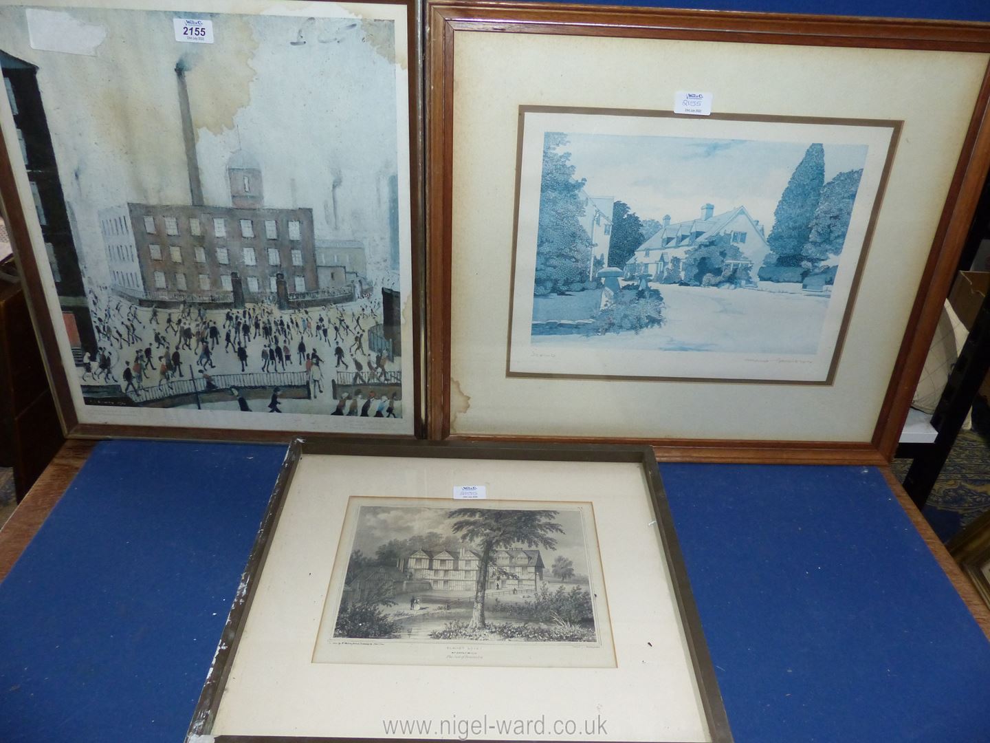 Three framed Prints to include Lowry, Elmley Lovet by W. Walton and a Cottage and garden.