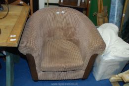 A brown corduroy bucket chair.