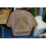 A brown corduroy bucket chair.