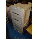 A pair of two drawer oak grain bedside cabinets.