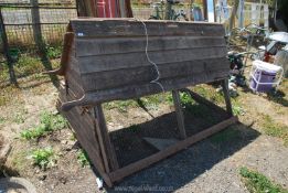 A large wooden chicken run with nest box above, in need of attention, 85" x 43".