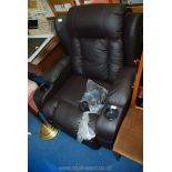 A reclining massage/Gaming chair in faux leather.