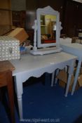 A grey painted wooden dressing table and mirror.
