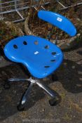 A blue adjustable office chair.