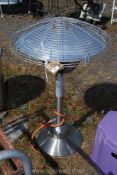 A gas powered table size patio heater 36" tall.