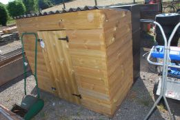 A garden shed. 69" wide x 56" high x 33" deep.