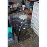 A glass topped dining table 35" diameter x 30" high and chrome framed stool.
