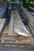 A quantity of rough cut planks (17 approximately).
