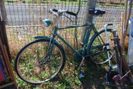 A vintage Raleigh gent's bike with original lights, etc.