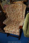 A Parker Knoll style rocking chair.