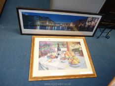 A panoramic picture of Venice and a print of a still life.