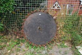 A swathe turning wheel with tines, 45'' diameter.