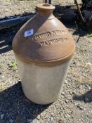 A large 'Shepherd Neame & Co. Haversham' cider Flagon and a metal umbrella base.