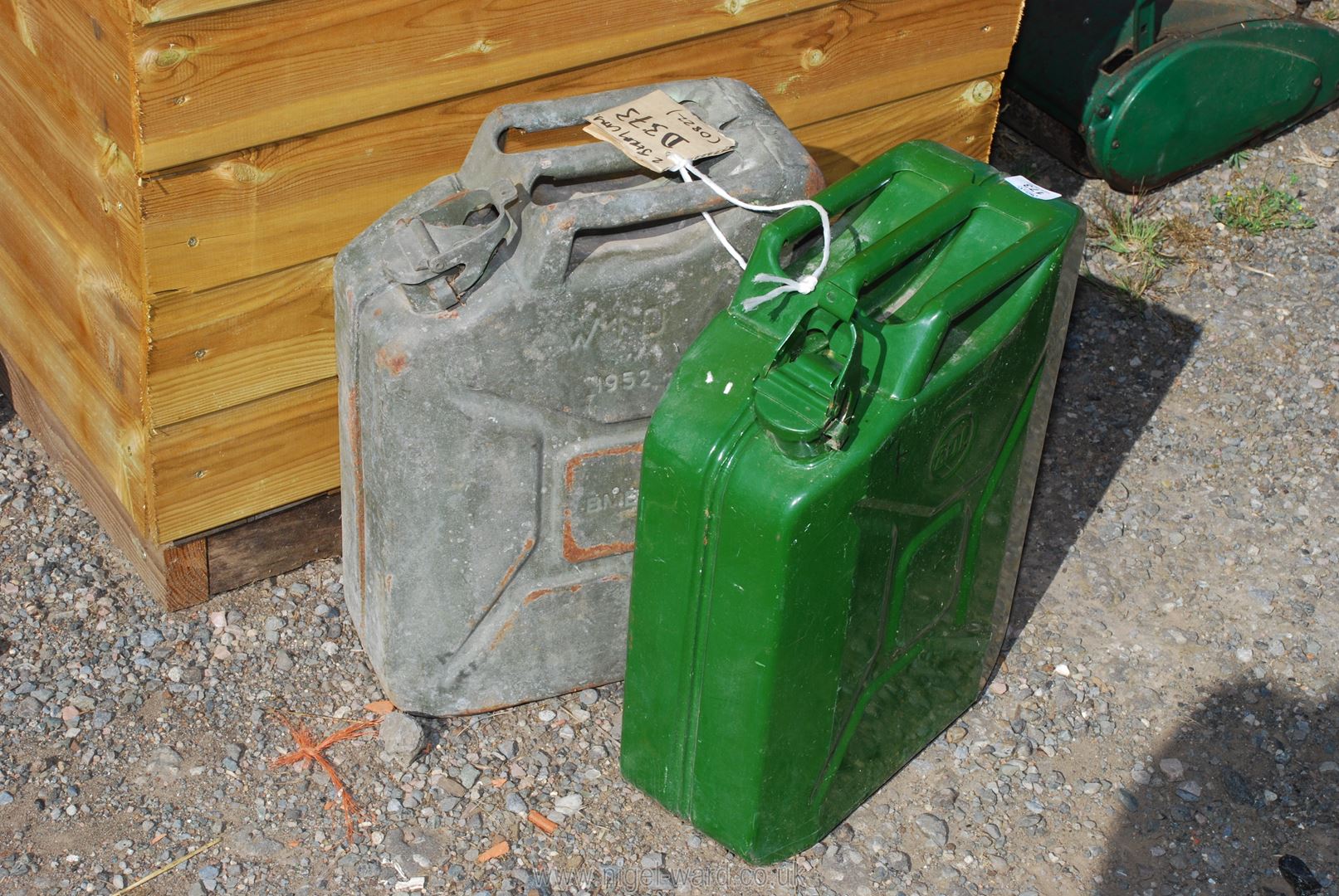 Two jerry cans, one military, other as new.