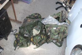 Two army rucksacks, kit bags, vests etc.