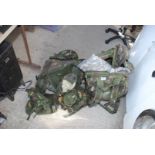 Two army rucksacks, kit bags, vests etc.