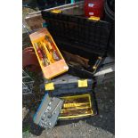 Two plastic tool boxes containing socket sets, saw, etc.