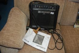 A Behringer 15 watt Ultra Bass amplifier.