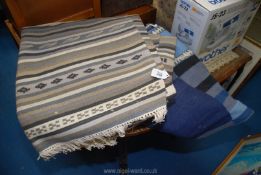 Two fringed rugs, one grey/beige/black 3m x 1.95m and the other blue/black 2.45m x 1.7m.