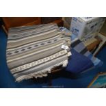 Two fringed rugs, one grey/beige/black 3m x 1.95m and the other blue/black 2.45m x 1.7m.