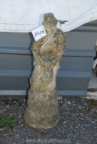 A concrete figure of a woman with dove, 34" tall.