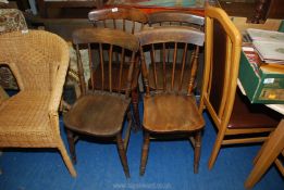 Four solid Elm seated antique stick-back kitchen chairs.