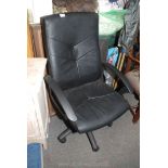 A large leather effect office chair.