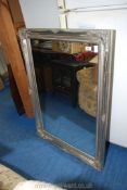 A large silver framed mirror, 29" x 41".
