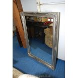 A large silver framed mirror, 29" x 41".