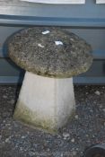 A concrete staddle stone, 20" x 17".