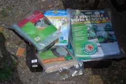 A quantity of plant fleeces, capillary matting, folding plastic planters, etc.