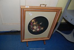 An illuminated fire screen of flowers.