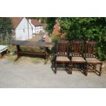 Six oak framed dining chairs and elm topped refectory style dining table, possibly Ercol,