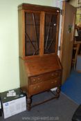 An Art Deco style Oak bureau bookcase, 16" deep x 28" wide x 72" tall.